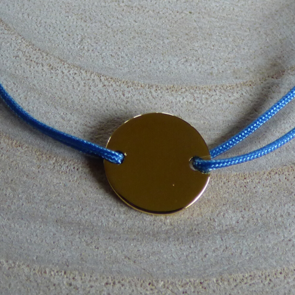 Bracelet lien bleu jean médaille plaqué or détail